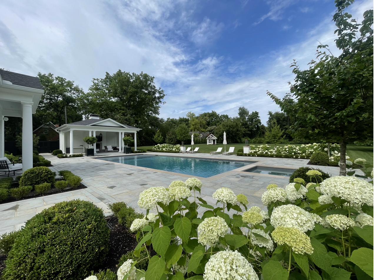Hydrangea plantings and pool surround with cabana in Brentwood TN